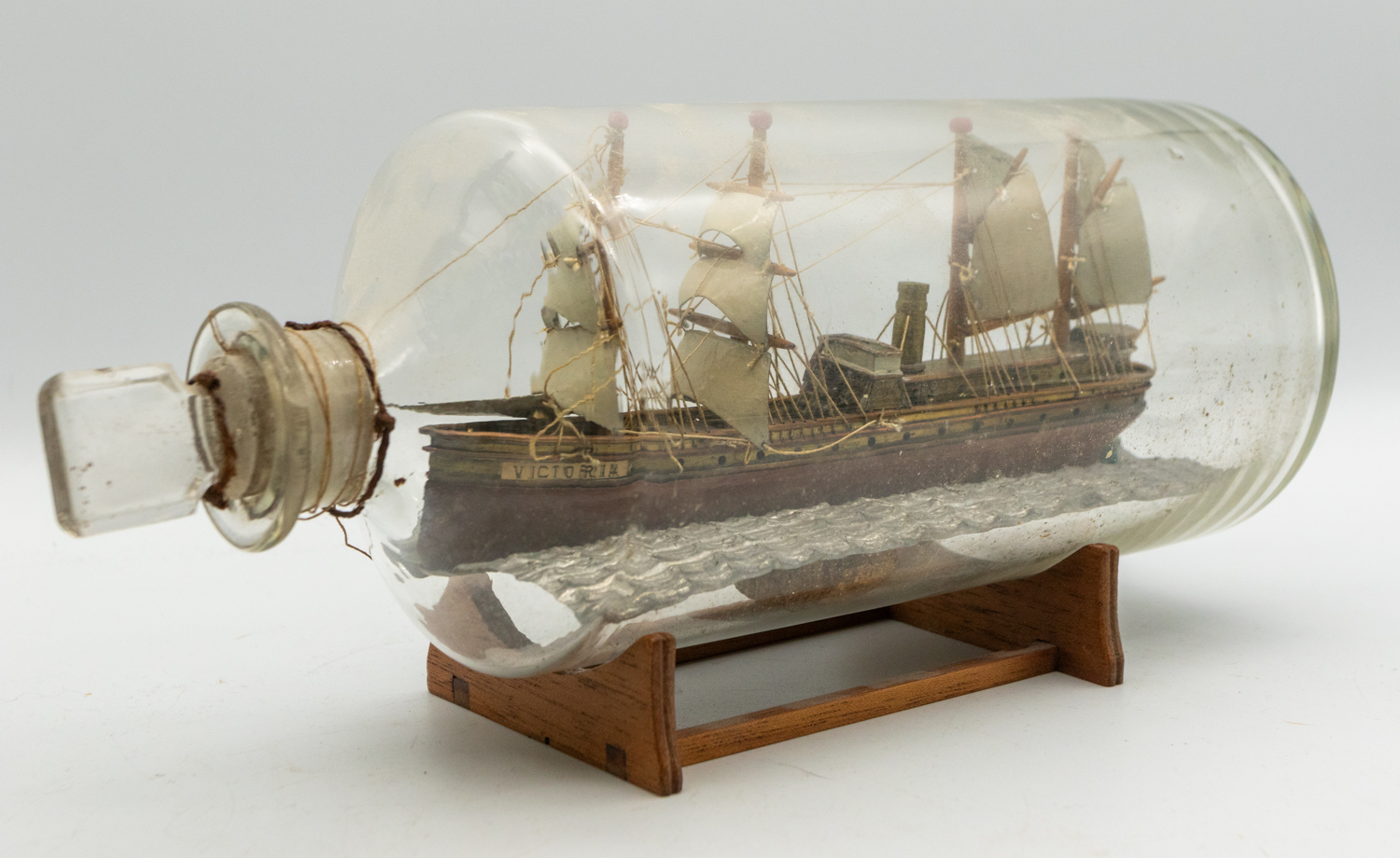 Two 19th century wooden models of Ship's in glass bottles; one encased in a light wooden frame of - Image 3 of 4