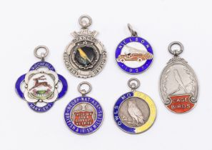 A collection of fob medals to include: a Birmingham silver fob with central enamelled deer and