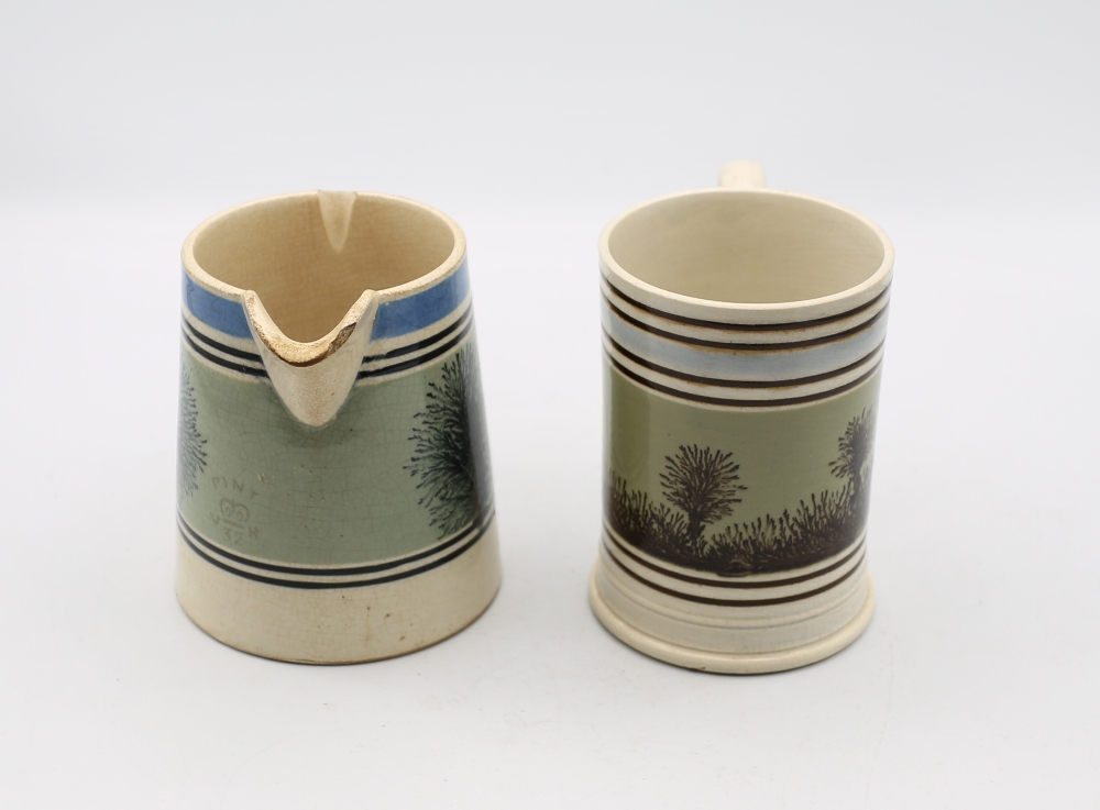 A pint sized Mocha ware mug, green ground with black feathered trees and pale blue and black - Image 4 of 7