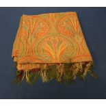 A large paisley shawl in a thick wool dating from c.1860/70: the design has a medallion detail and