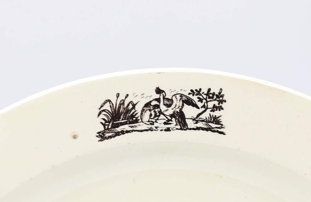 A late 18th century creamware plate, Liverpool, with a print of a war ship and birds printed in - Image 3 of 7