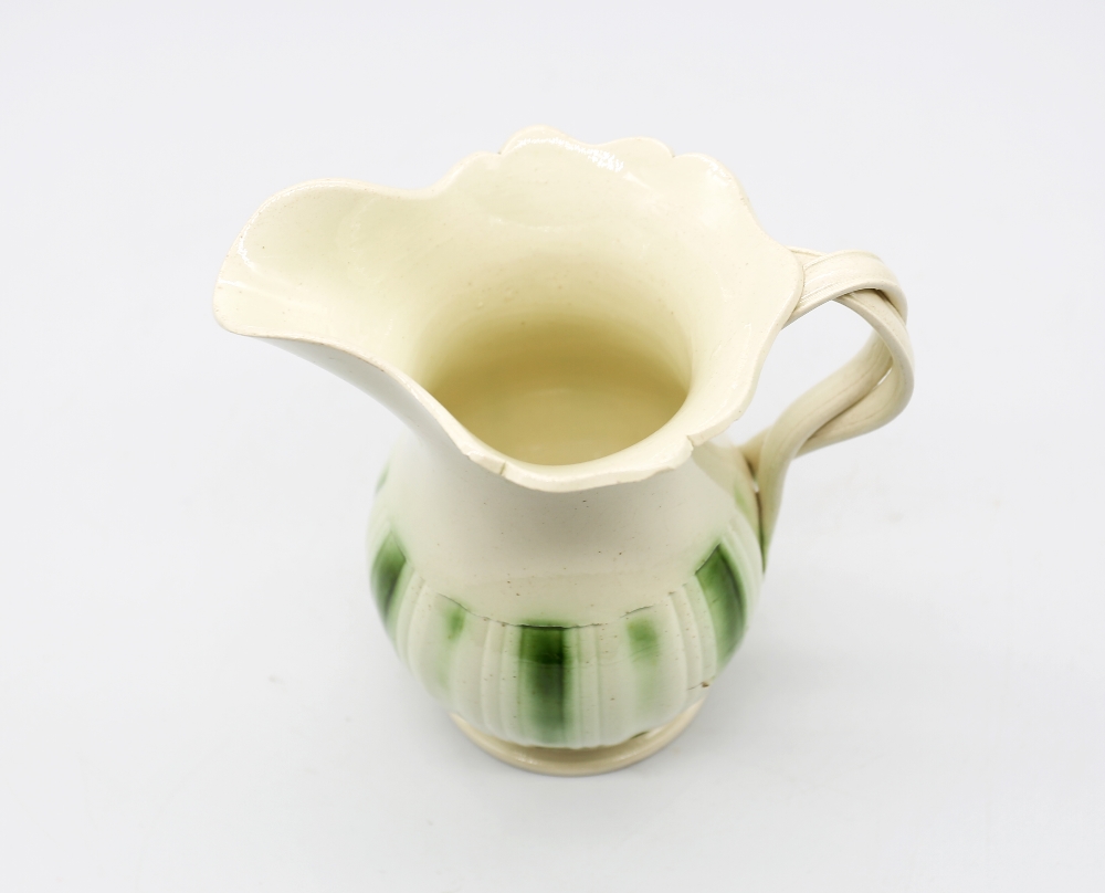 A Leeds creamware jug, with a flared scalloped rim and spout with a crossed strap handle, - Image 5 of 9