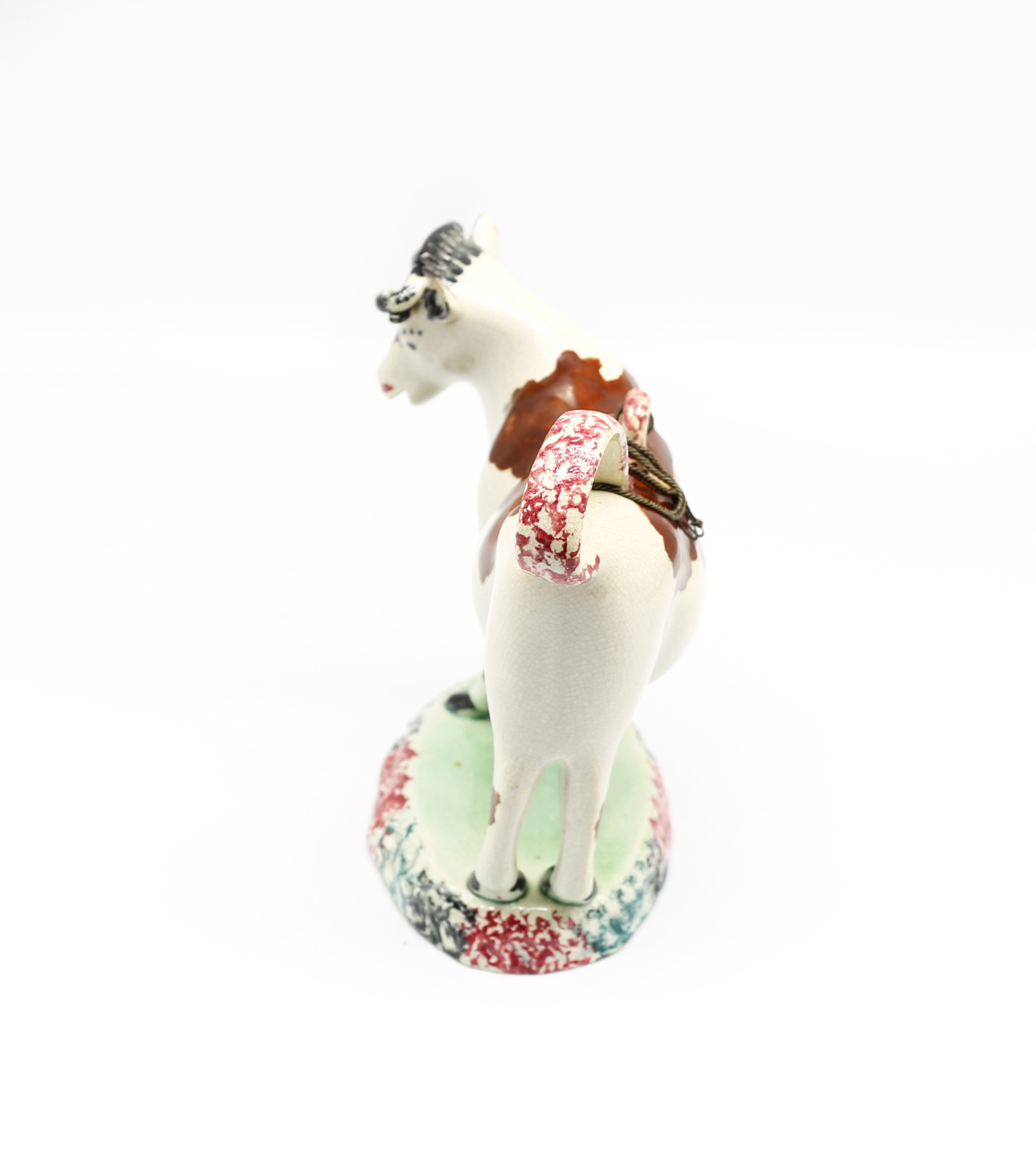 A North country pottery cow creamer and cover, standing on a green base with a mottled coloured base - Image 4 of 13