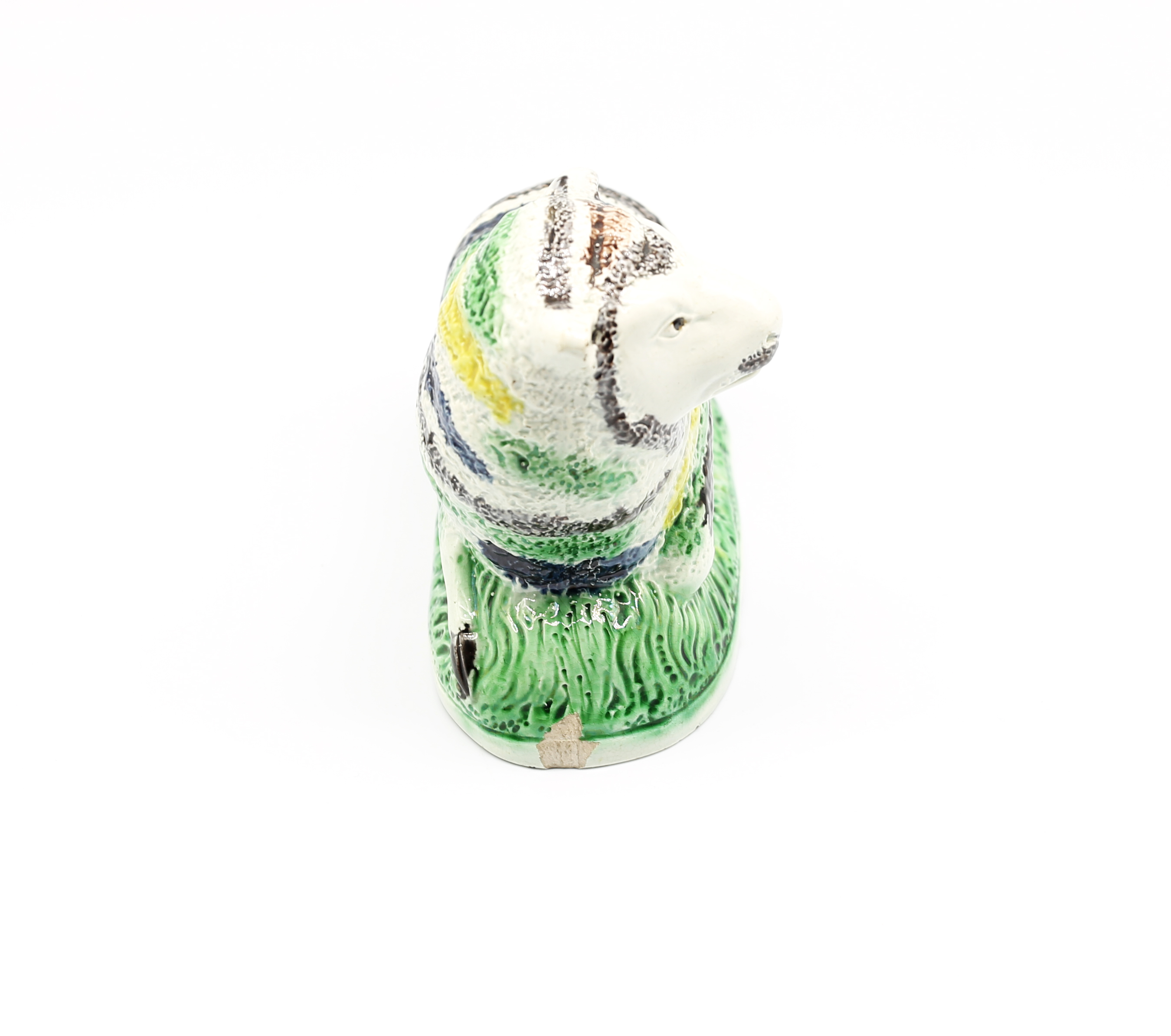 A pottery model of a recumbent Ewe, decorated with green, yellow and black stripes.  Circa 1800- - Image 2 of 7