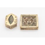 Two Mughal white metal 19th or 20th century weights, one of rectangular shape with engraved floral/