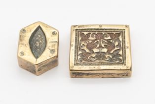 Two Mughal white metal 19th or 20th century weights, one of rectangular shape with engraved floral/