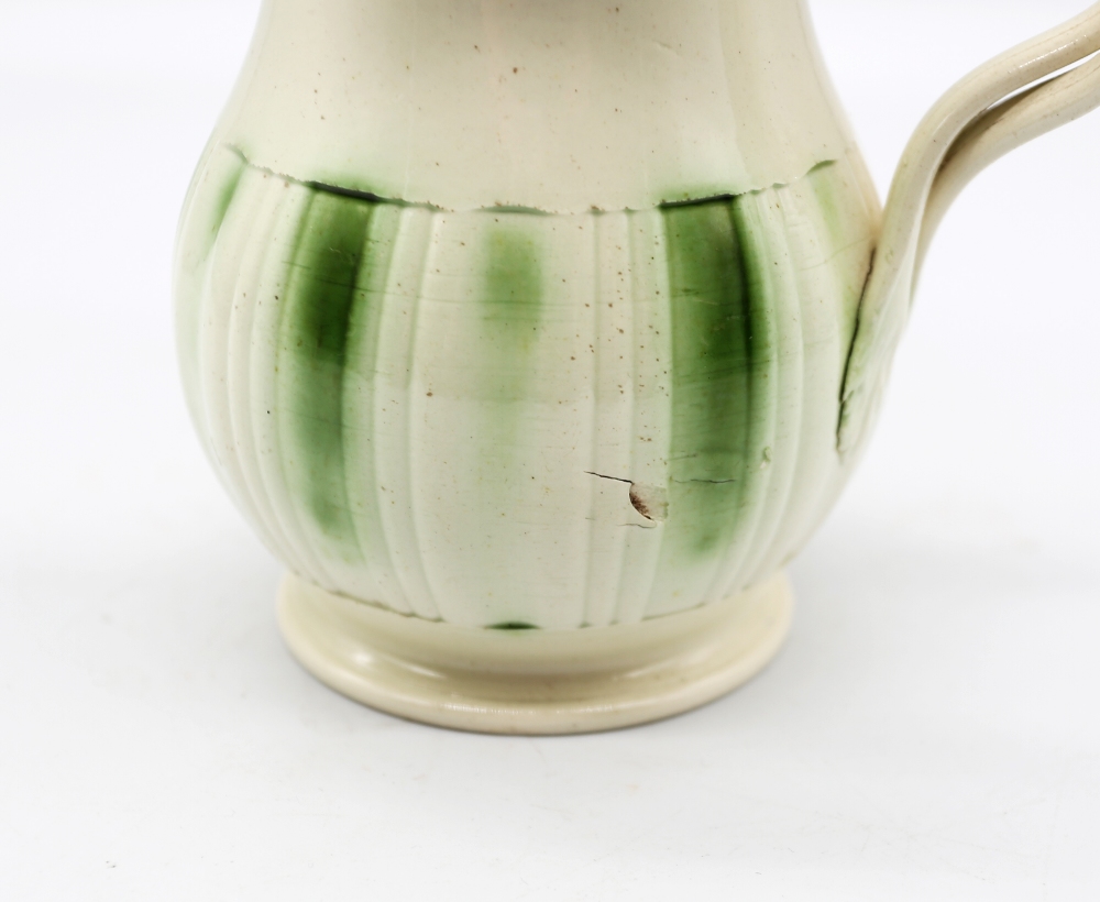 A Leeds creamware jug, with a flared scalloped rim and spout with a crossed strap handle, - Image 6 of 9