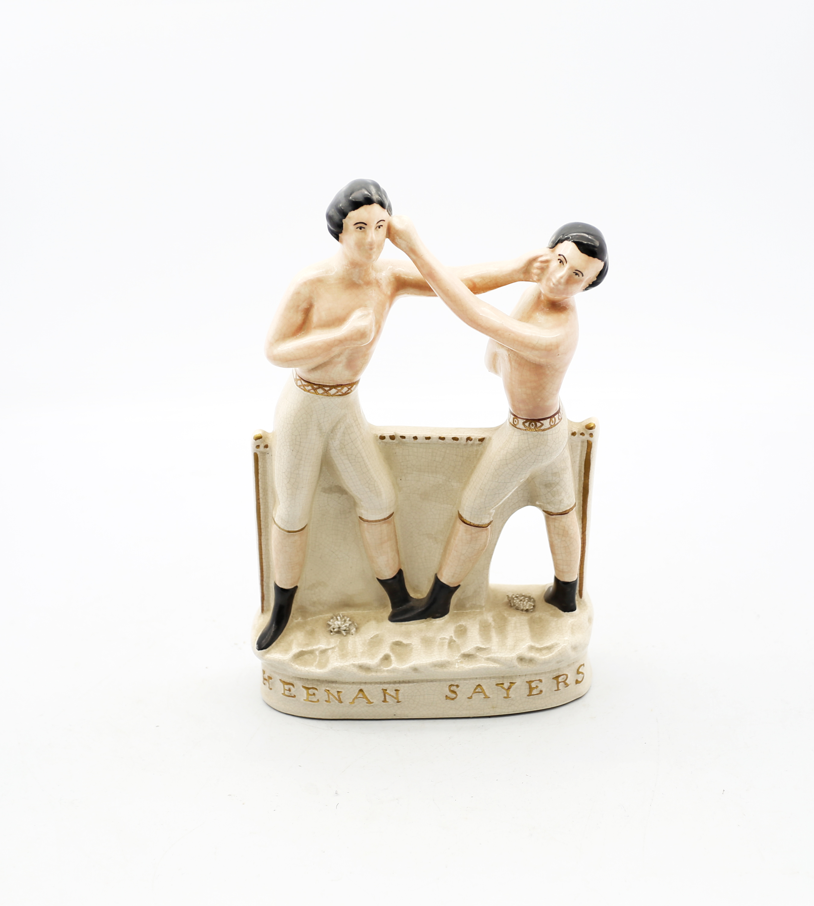 A reproduction Staffordshire white and gilt figure of Heenan and Sayers standing on an oval base.