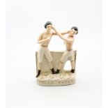 A reproduction Staffordshire white and gilt figure of Heenan and Sayers standing on an oval base.