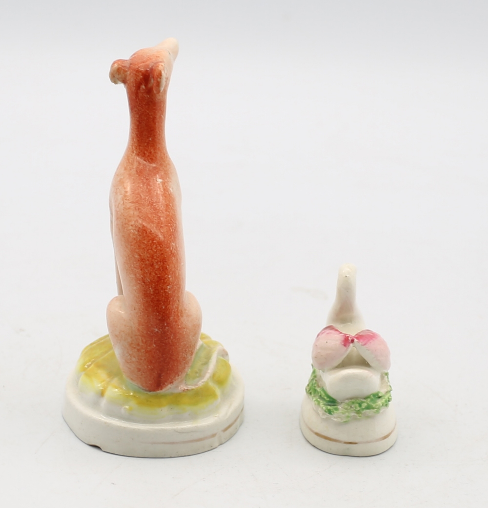 A Small Staffordshire pottery Whippet sitting a a round green base with a gilt band, along with a - Image 4 of 5