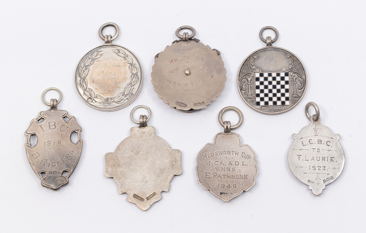 A collection of seven assorted silver hallmarked sporting fobs, to include: bowls, dominoes, darts - Image 2 of 2