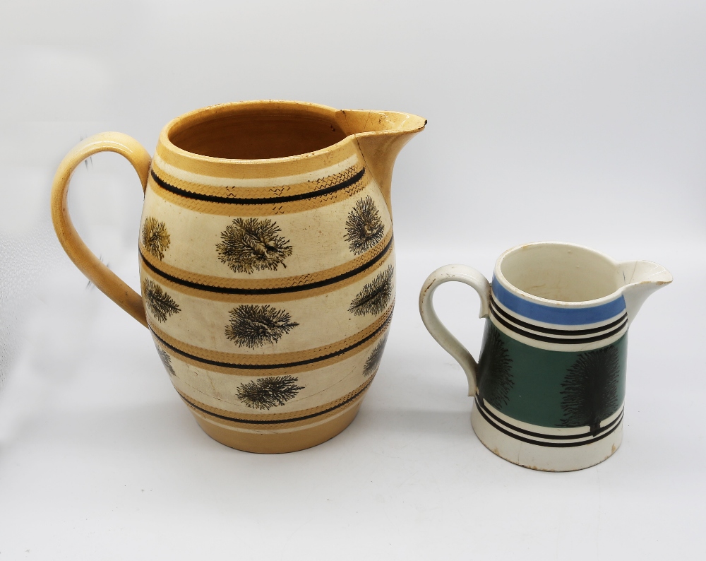 A large mocha ware pitcher, cream ground with ochre and black bands with black trees. C 1810, - Image 4 of 5
