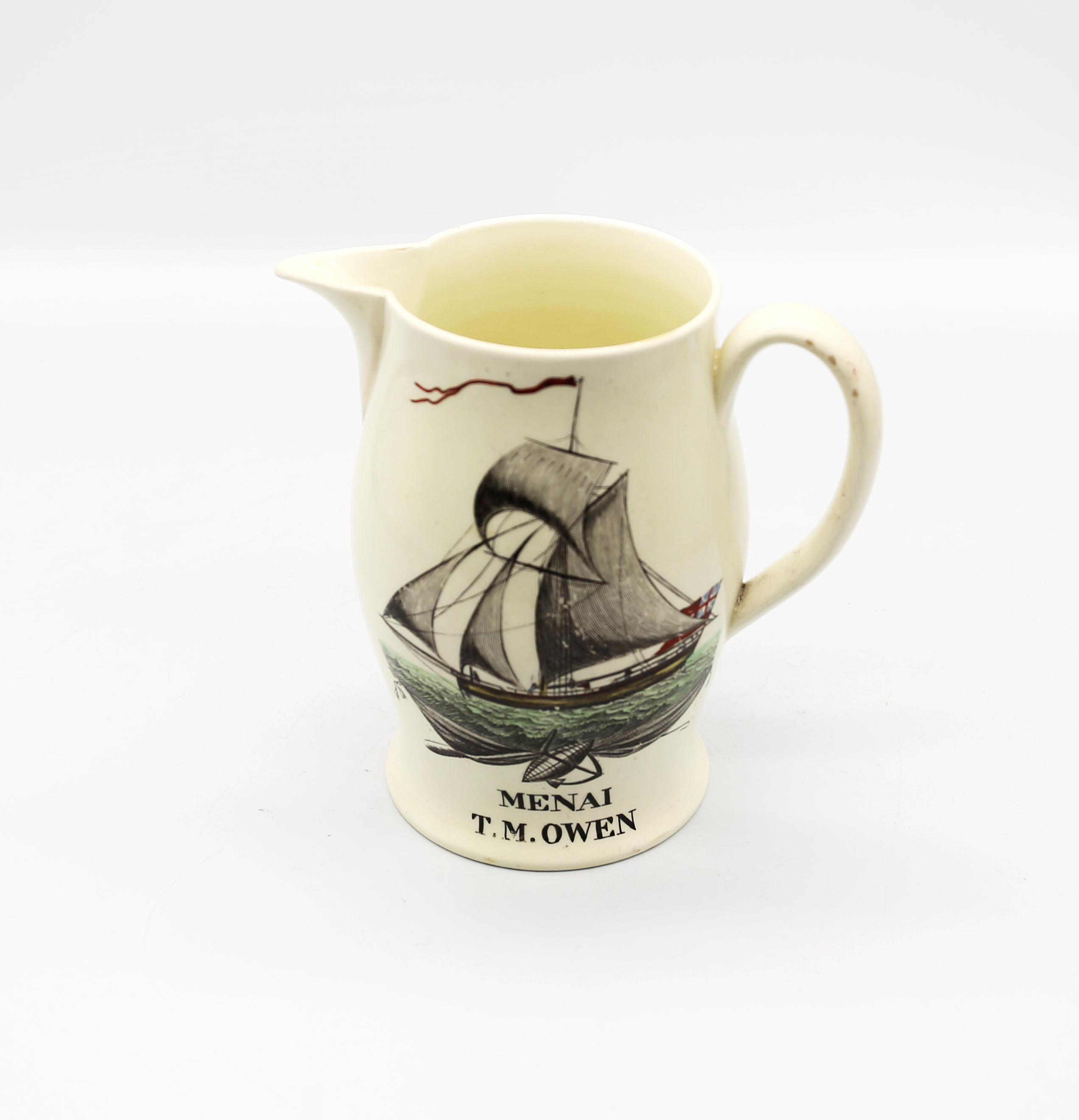 A Liverpool creamware jug, black transfer printed depicting a three masted sailing ship with the