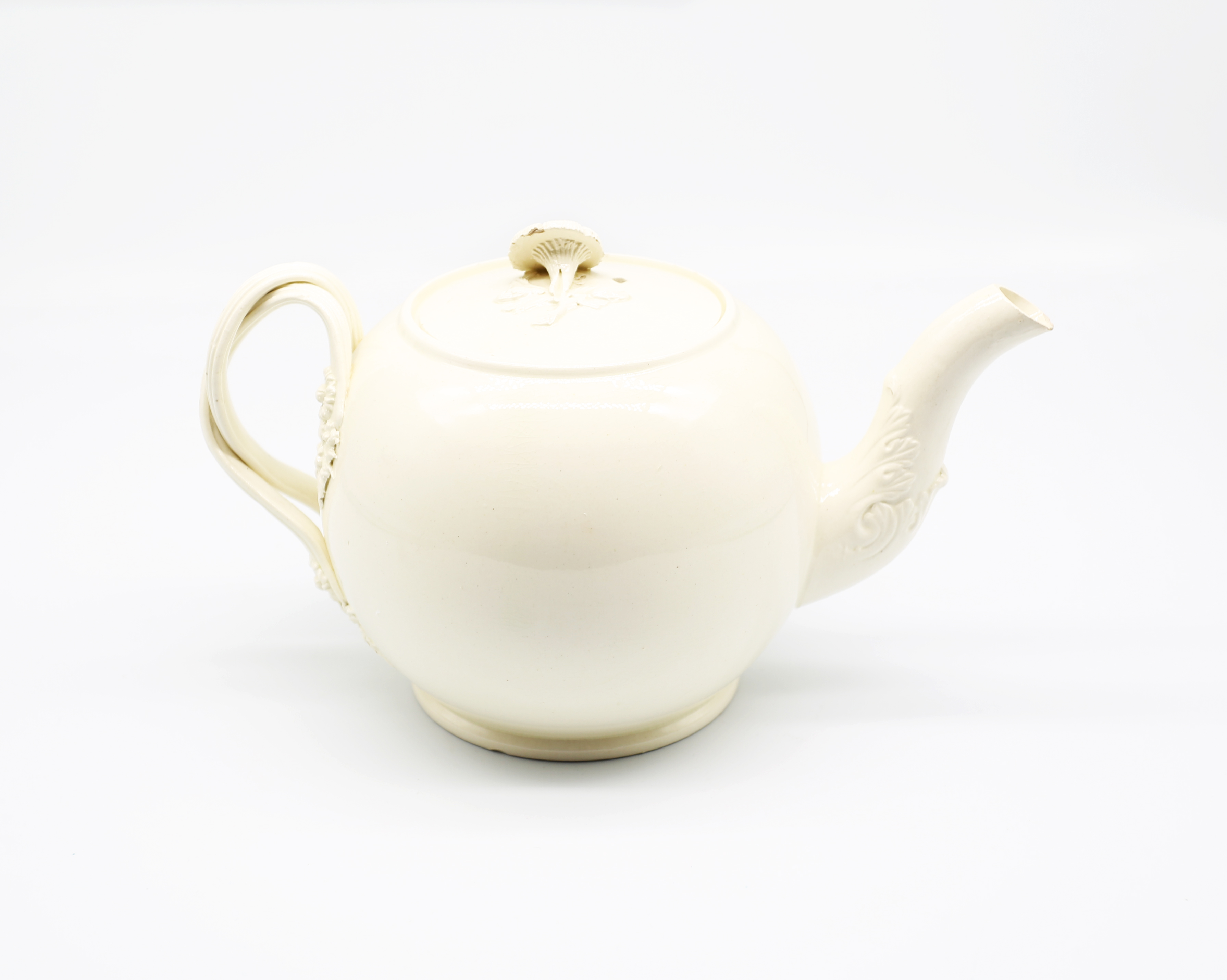 A Leeds creamware globular teapot and cover, with a twisted strap handle and floret terminals, the - Image 3 of 17