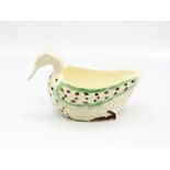 A Staffordshire creamware duck sauce boat decorated in green and brown.  Circa 1780-90 size 19cm x