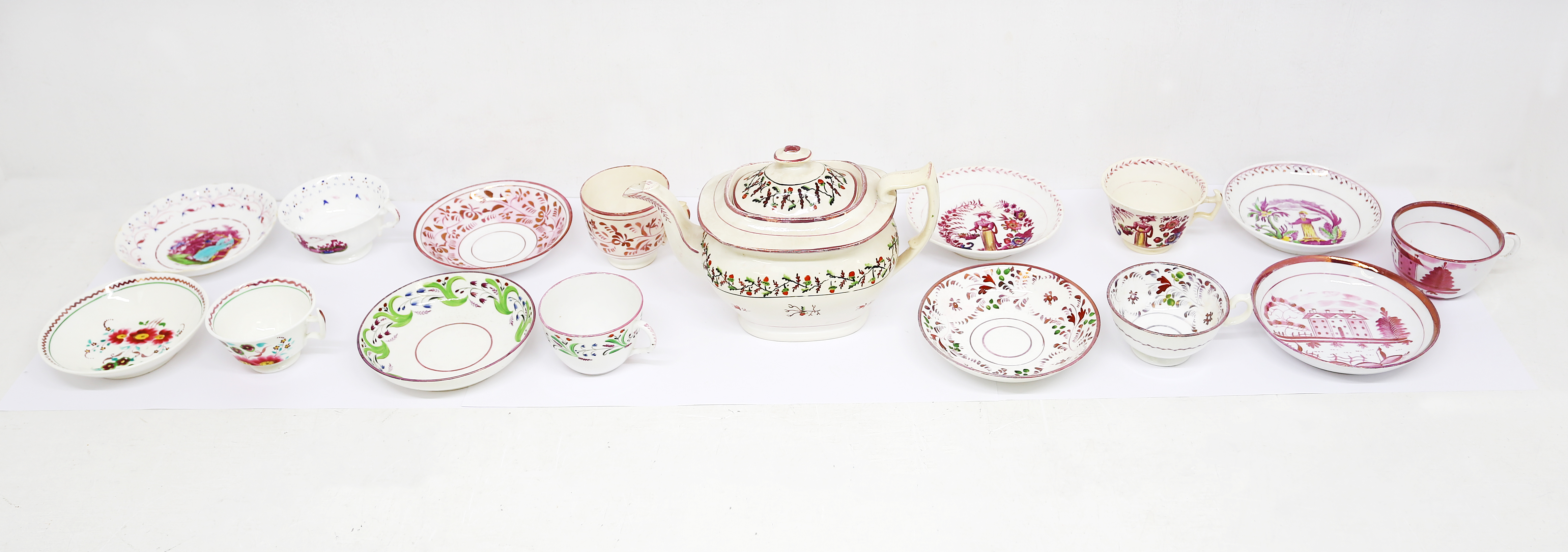 A small collection of 19th century cups, saucers and teapot. Various patterns and borders, all