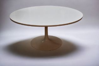 An Arkana circular dining table of white formica, diameter 150cm, on a shaped metal stand
