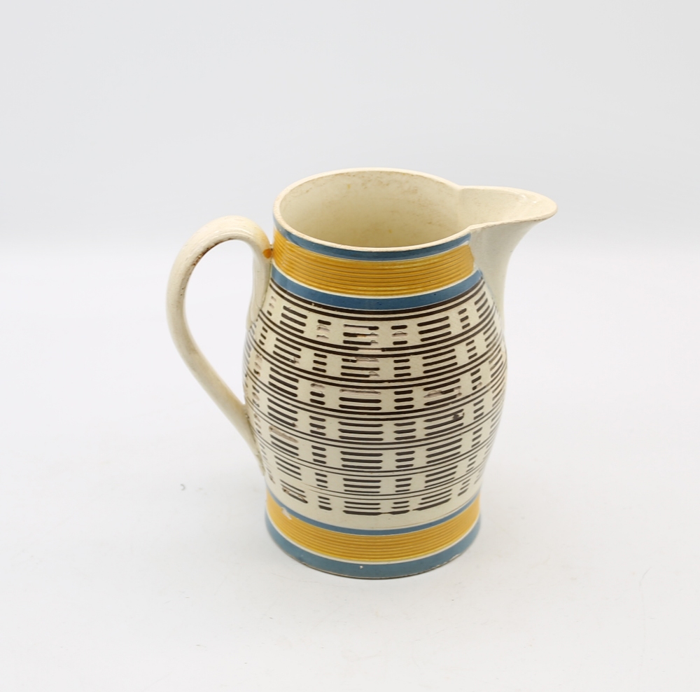A creamware engine turned jug, with a black lined inlay and blue and ocher banded borders to top and - Image 3 of 10