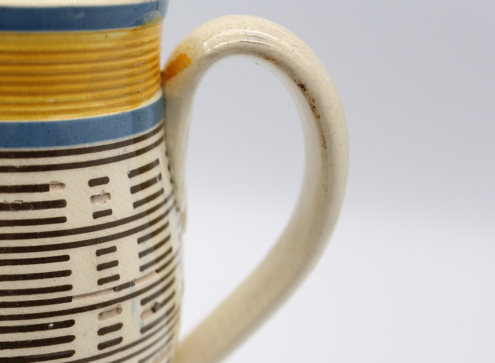 A creamware engine turned jug, with a black lined inlay and blue and ocher banded borders to top and - Image 6 of 10