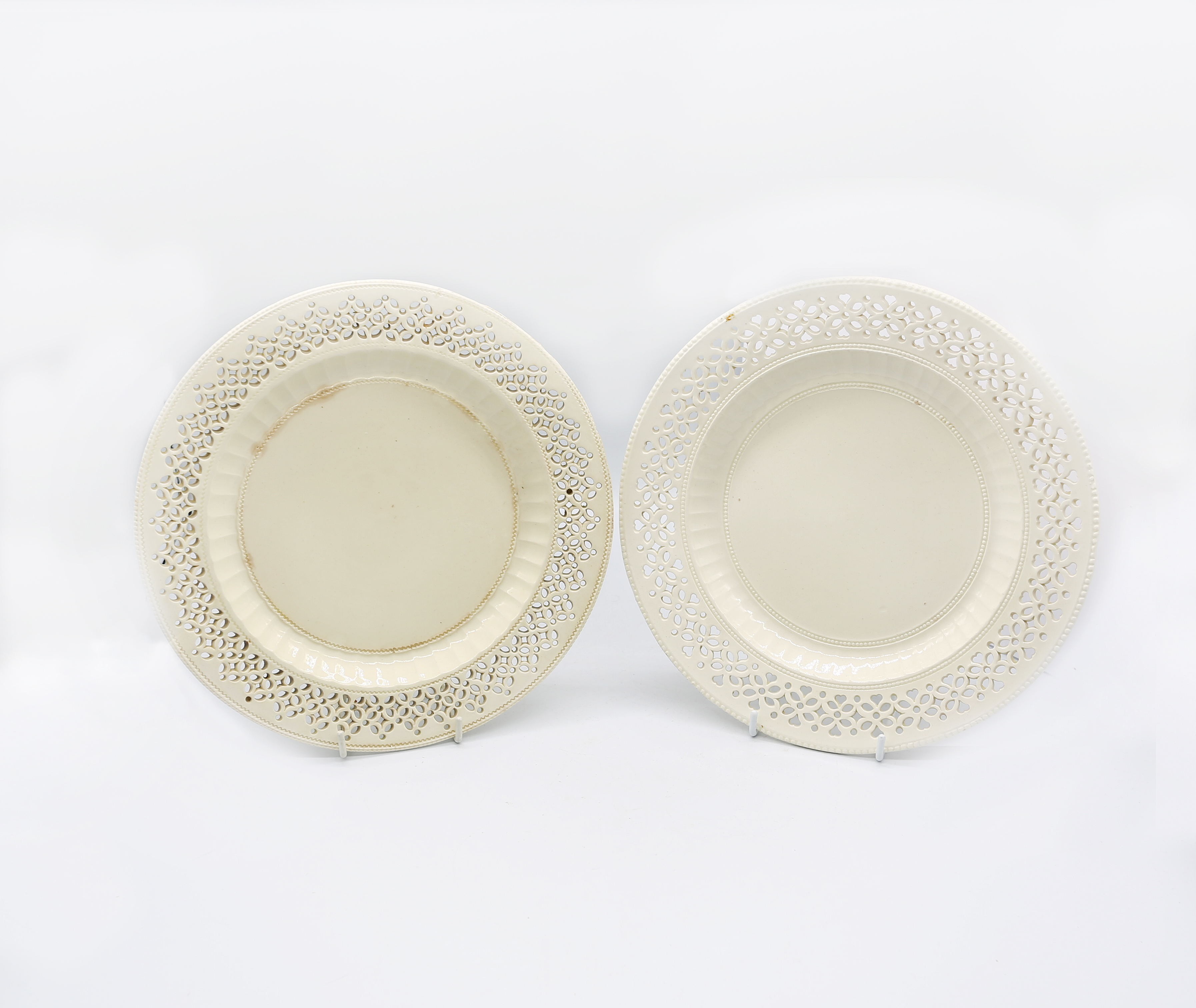 Two 18th century creamware plates with fluted pierced borders  (2) Circa 1770-80. Size. 24cm
