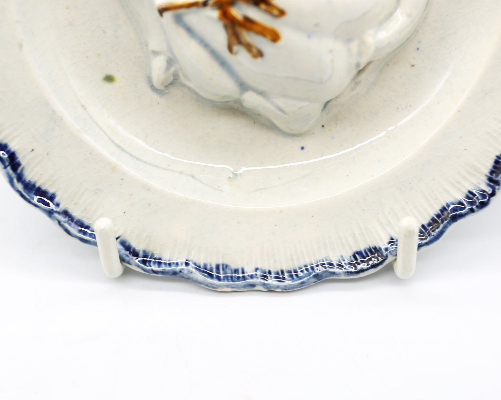 A pearlware ‘Toy’ round plate with a goose moulded in the centre with a blue feathered border. - Image 3 of 12