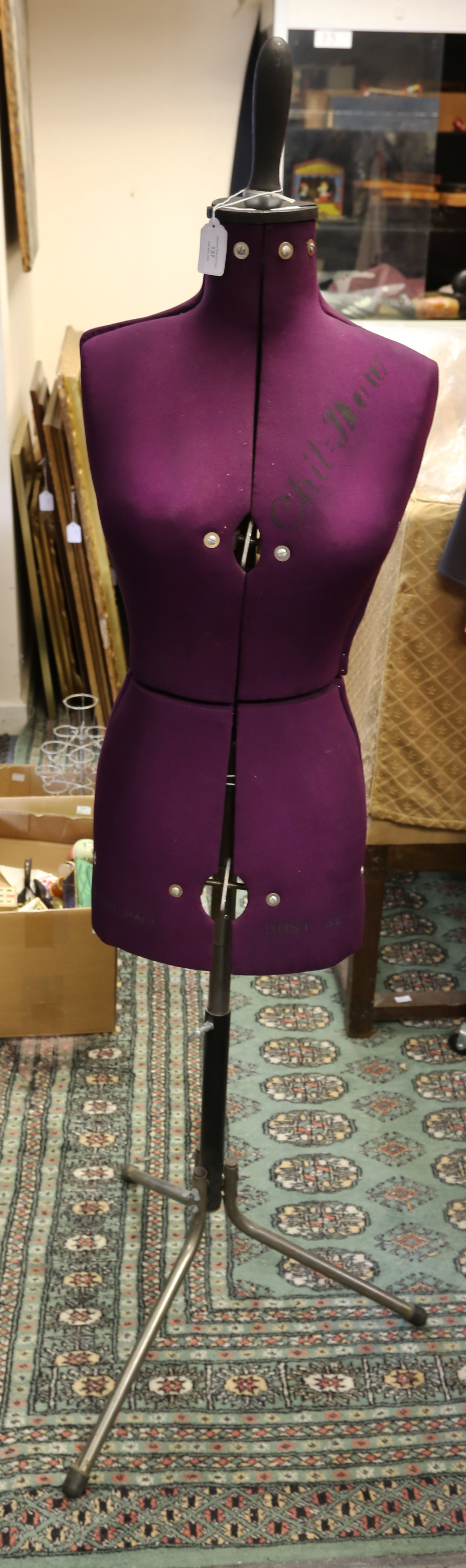 A late 1950s' tailor's dummy. The body is a deep burgundy colour and has Chil-Dolles printed