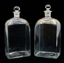 A pair of early Victorian clear glass flask decanters with gilt detail shoulders, hand blown, with