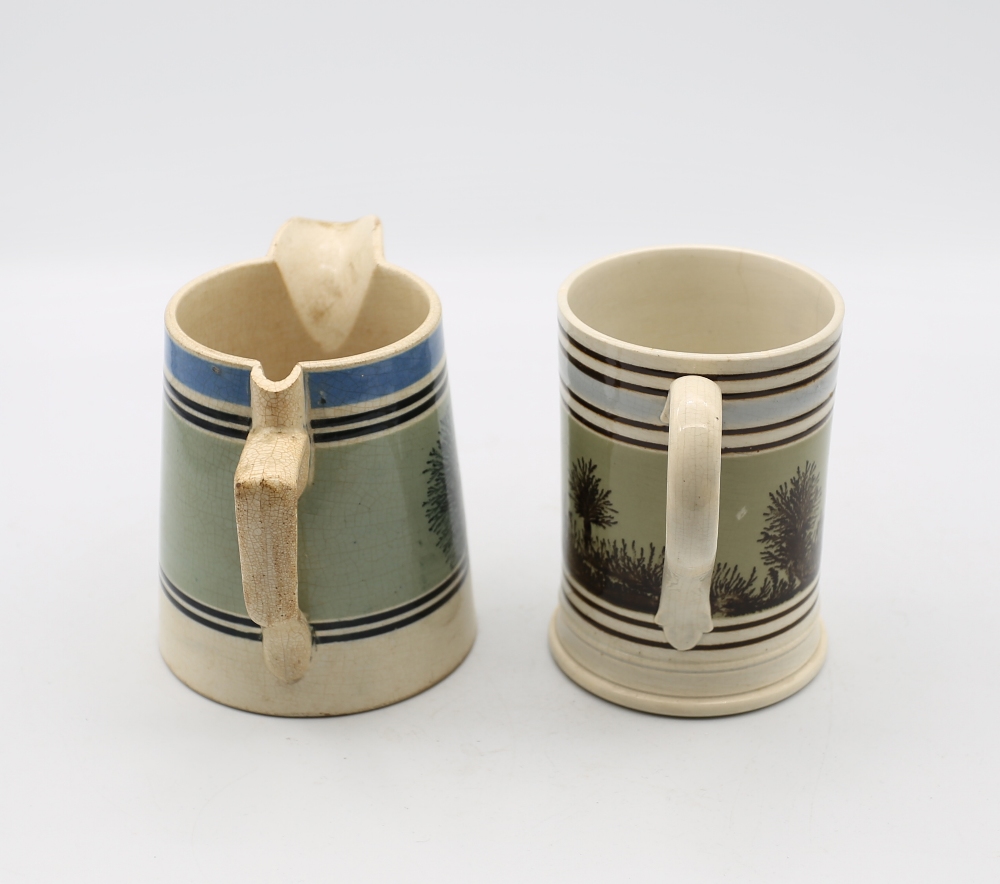 A pint sized Mocha ware mug, green ground with black feathered trees and pale blue and black - Image 2 of 7
