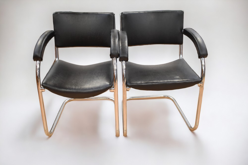 A pair of PEL cantilever chrome chairs