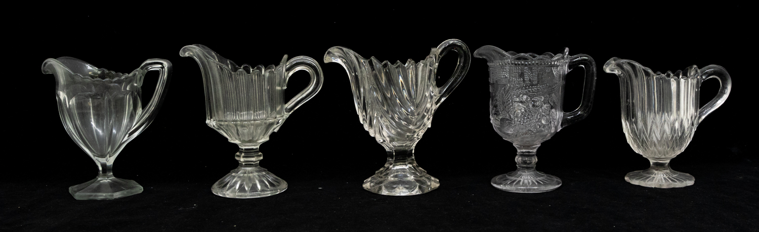 A collection of 19th Century moulded glass cream jugs. - Image 3 of 3