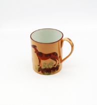 A 19th century pearlware mug, orange ground with a red top rim line, painted with two hounds chasing