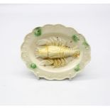 A creamware ‘Toy’ oval platter with a lobster moulded to the centre and a moulded border with