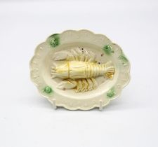 A creamware ‘Toy’ oval platter with a lobster moulded to the centre and a moulded border with