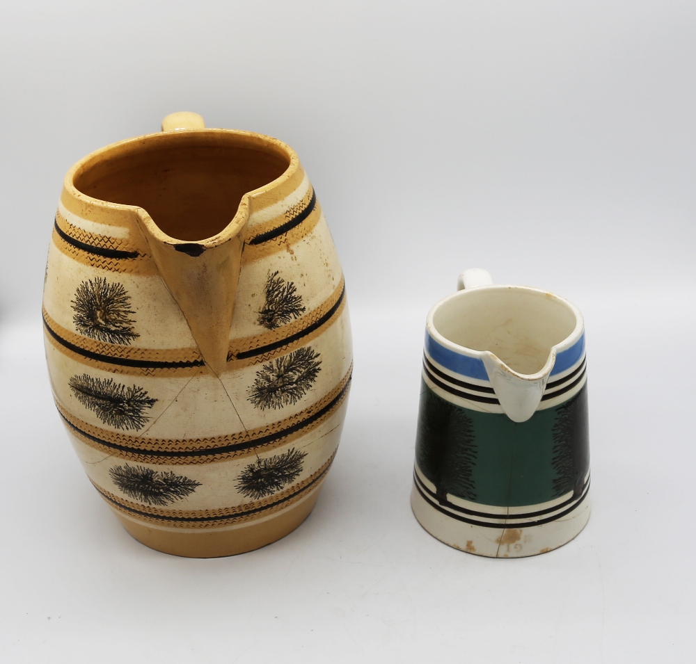 A large mocha ware pitcher, cream ground with ochre and black bands with black trees. C 1810, - Image 3 of 5