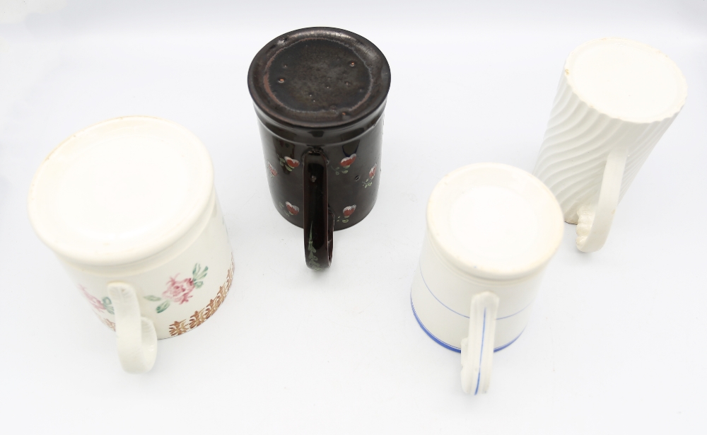 A  Jackfield mug painted with pink and white flower sprigs, along with a mug with a printed motif of - Image 3 of 3