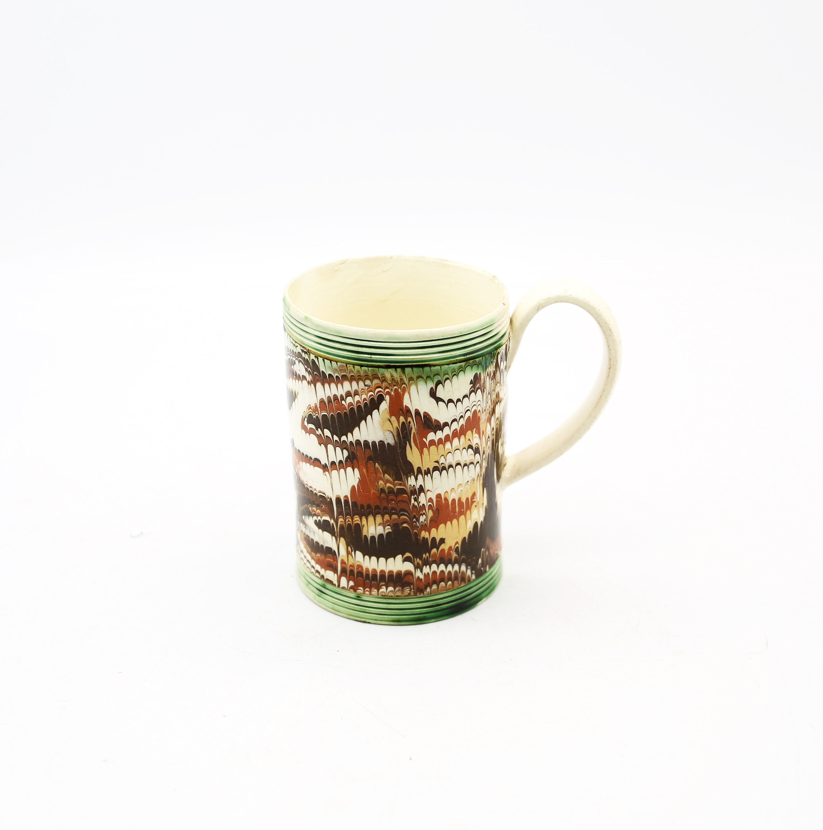 A small cylindrical creamware mug with coloured feathered marbling, with green ribbed bands to rim