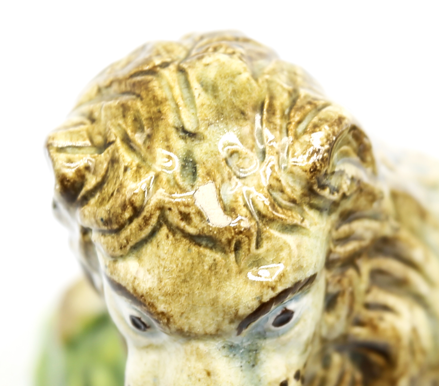 A pearlware model of a recumbent lion laying on a grassy mound on a base with moulded relief.  Circa - Image 7 of 8