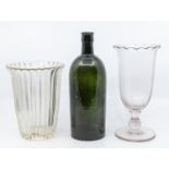 An 18th Century green glass rum bottle, an early 19th Century fluted vase and a Victorian celery