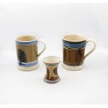 A Mocha ware Quart sized mug, mid brown ground with feathered sepia trees, blue band and six black