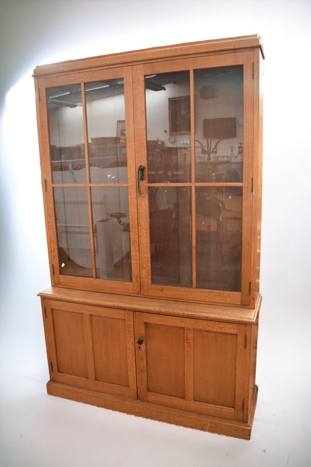 A mid-20th century glazed display cabinet in mahogany and pine, 140 x 210 x 40cm