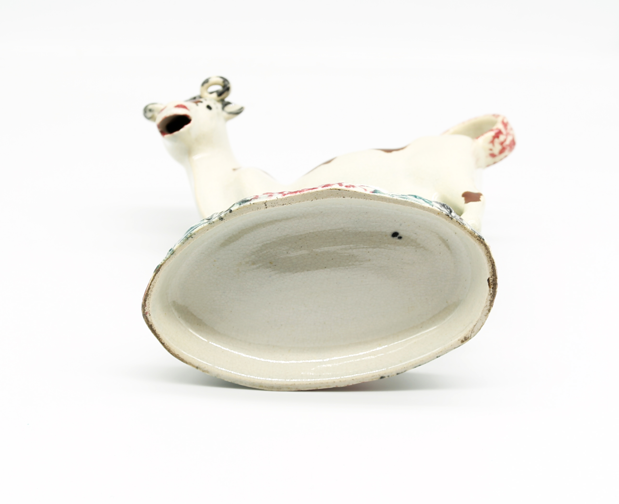 A North country pottery cow creamer and cover, standing on a green base with a mottled coloured base - Image 6 of 13