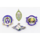 A small collection of four silver and enamel pin badges to include; a George V silver gilt '