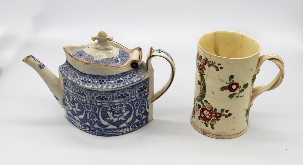 A Leeds creamware mug painted with flower sprays and an inscription LP 1775, with twisted strap