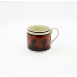 A creamware Mocha mug, dark terracotta ground with back feathered trees and black bands  Circa