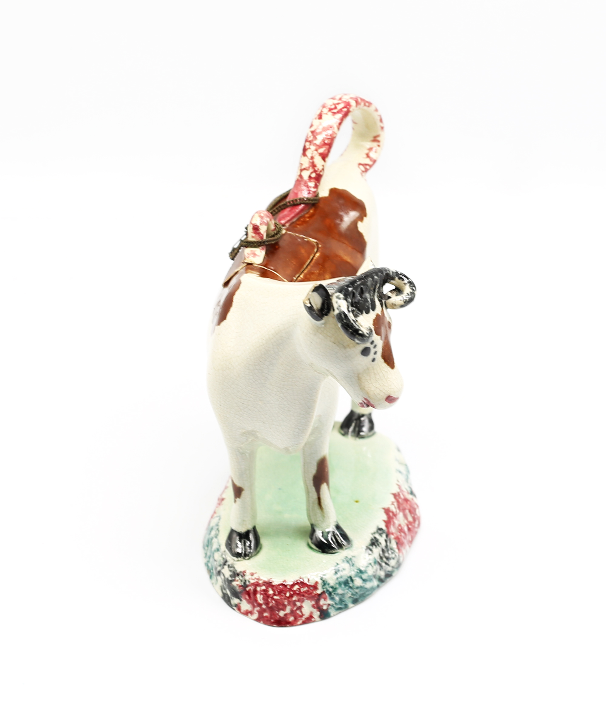 A North country pottery cow creamer and cover, standing on a green base with a mottled coloured base - Image 2 of 13
