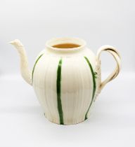 A large 18th century creamware Punch pot, with a ribbed body and spout, decorated with green stripes