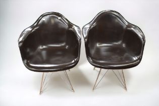 A pair of Herman Miller fibreglass and chrome easy chairs