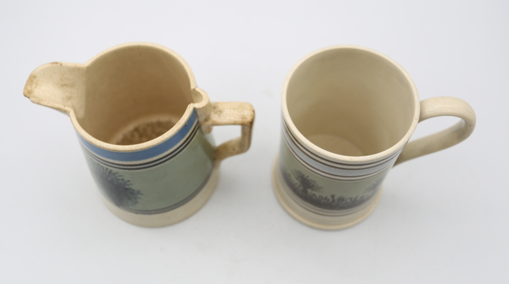 A pint sized Mocha ware mug, green ground with black feathered trees and pale blue and black - Image 5 of 7