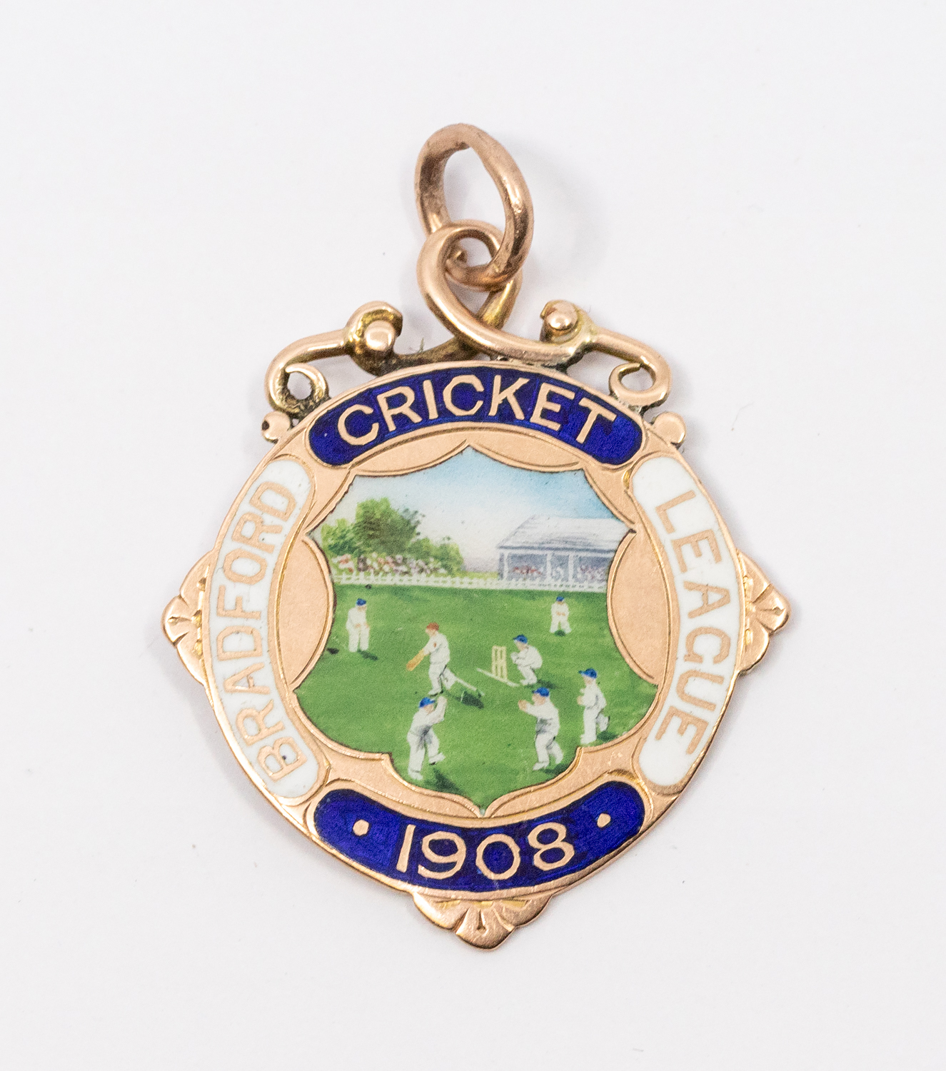 A 9ct gold and enamelled Bradford Cricket League 1908 medal, engraved to the reverse 'Winners Gt