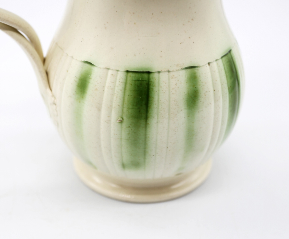 A Leeds creamware jug, with a flared scalloped rim and spout with a crossed strap handle, - Image 7 of 9